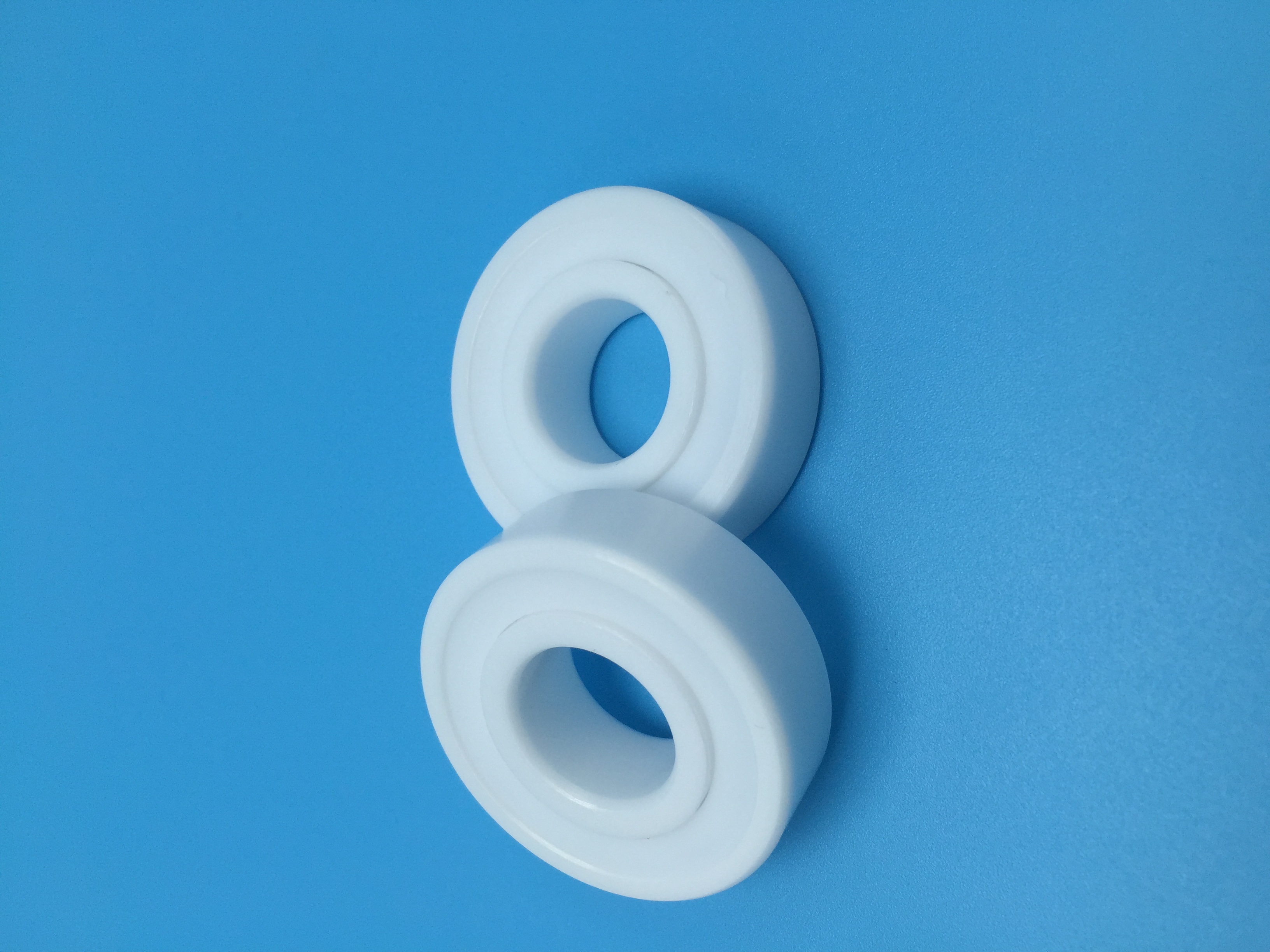 White Plastic Sleeves on Blue